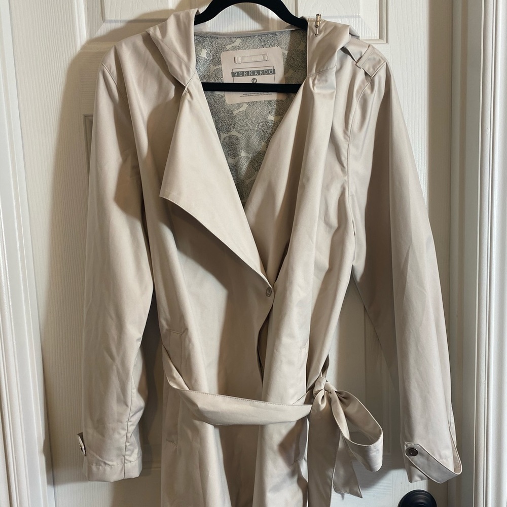Light tan trench coat with belt tie and hood